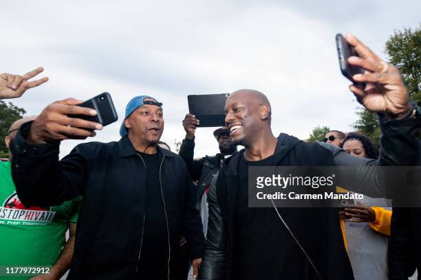 Deon Taylor and Tyrese Gibson interact with fans during the "Black & Blue" cast members' visit to Morehouse College on October 24, 2019 in Atlanta,...