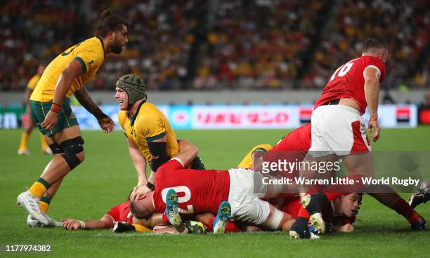 David Pocock of Australia wrestles with Ross Moriarty of Wales during the Rugby World Cup 2019 Group D game between Australia and Wales at Tokyo...