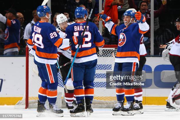 Josh Bailey of the New York Islanders is congratulated by his teammates after scoring a goal against the Arizona Coyotes during the second period at...