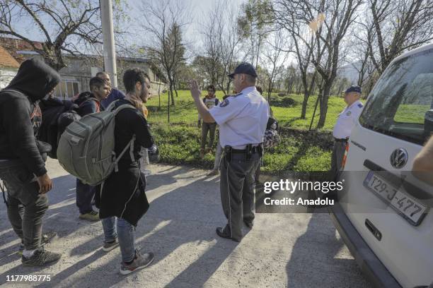 Border police speaks with migrants, who try to cross the natural borders into Croatia, during a border patrol of Bosnia and Herzegovina's Border...