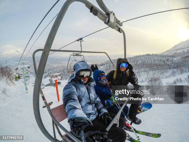 winter in niseko, japan. - family skiing stock pictures, royalty-free photos & images