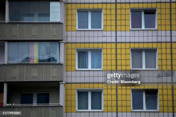 German national flag hangs on display in the window of a private apartment in the Friedrichshain district of Berlin, Germany, on Thursday, Oct. 24,...