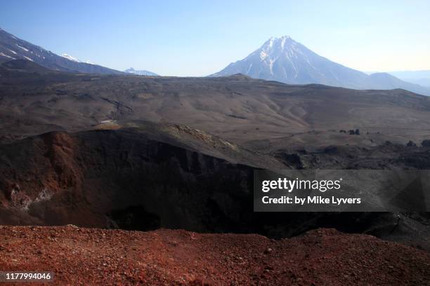 view of crater of main 2012-3 cinder cone and distant udina volcano - lava stock pictures, royalty-free photos & images