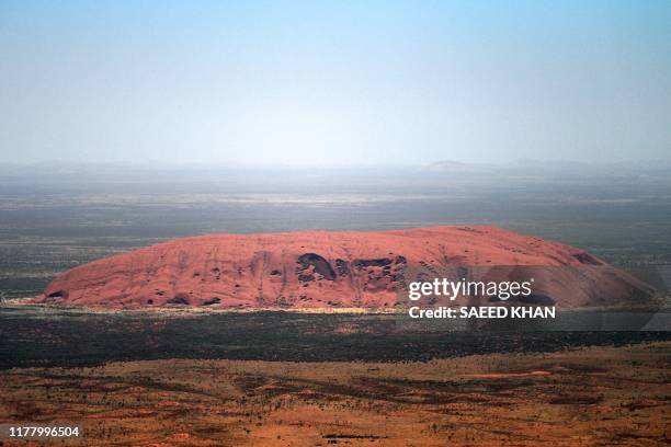 An aerial view of Uluru, also known as Ayers Rock, is seen ahead of a permanent ban on climbing the monolith, at Uluru-Kata Tjuta National Park in...