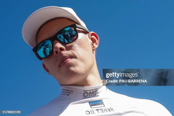 Estonian driver Ott Tanak looks on as he arrives at the parc ferme during the second day of the Catalonia 2019 FIA World Rally Championship on...