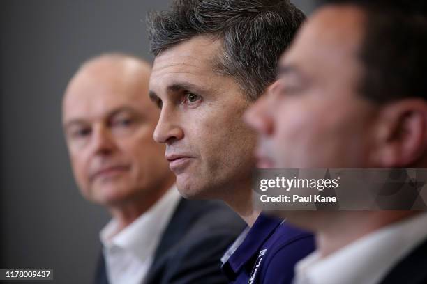 Justin Longmuir, coach of the Fremantle Dockers addresses the media together with Dale Alcock and Peter Bell during a Fremantle Dockers AFL press...