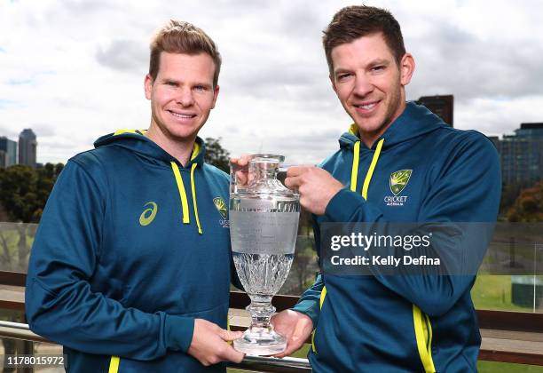 Steve Smith and Tim Paine pose with the Ashes Trophy at Melbourne Cricket Ground on September 30, 2019 in Melbourne, Australia. Australia beat...