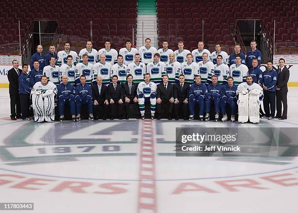 The Vancouver Canucks pose for their official team photo at Rogers Arena on March 17, 2011 in Vancouver, British Columbia, Canada. - Front Row - Cory...