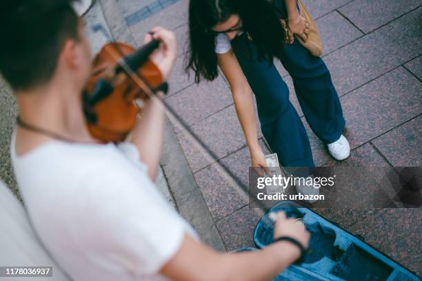 busker playing violin - busker stock pictures, royalty-free photos & images