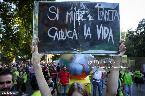 Demonstrators hold banners at the demonstration in Madrid organized by Fridays For Future, Alianza por el Clima, Alianza por la Emergencia Climática...