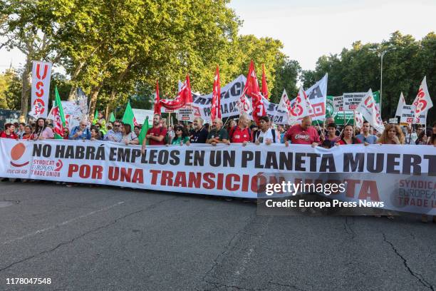 Demonstrators hold banners at the demonstration in Madrid organized by Fridays For Future, Alianza por el Clima, Alianza por la Emergencia Climática...