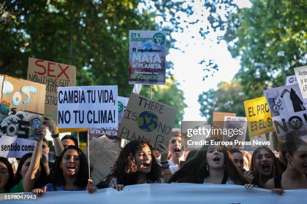 Demonstrators hold banners at the demonstration in Madrid organized by Fridays For Future, Alianza por el Clima, Alianza por la Emergencia Climática...