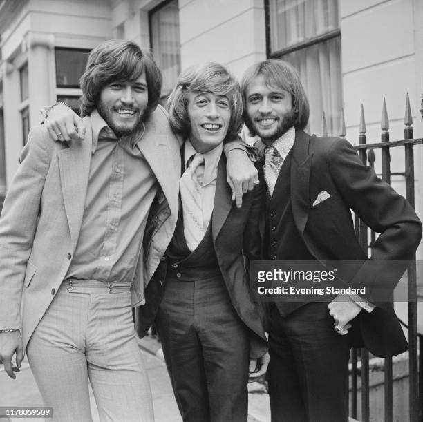 From left, Barry Gibb, Robin Gibb and Maurice Gibb of pop group Bee Gees posed together in London on 4th September 1970.