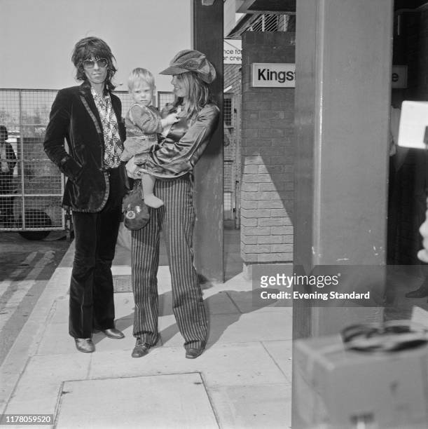 English musician Keith Richards of the Rolling Stones, girlfriend Anita Pallenberg and their son Marlon, arrive at London's Heathrow Airport for a...