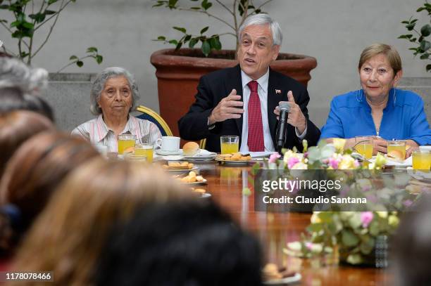 President of Chile Sebastian Piñera speaks to the media accompanied by social leaders before signing a law project to raise pensions at Palacio de la...