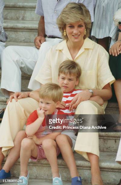 Diana, Princess of Wales with her sons William and Harry during a holiday with the Spanish royal family at the Marivent Palace in Palma de Mallorca,...