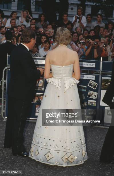 Diana, Princess of Wales attends the premiere of the James Bond film 'The Living Daylights' in London, June 1987. She is wearing an Emanuel dress and...