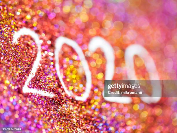 2020 happy new year background multicoloured  glitter - 2020 vision stock pictures, royalty-free photos & images