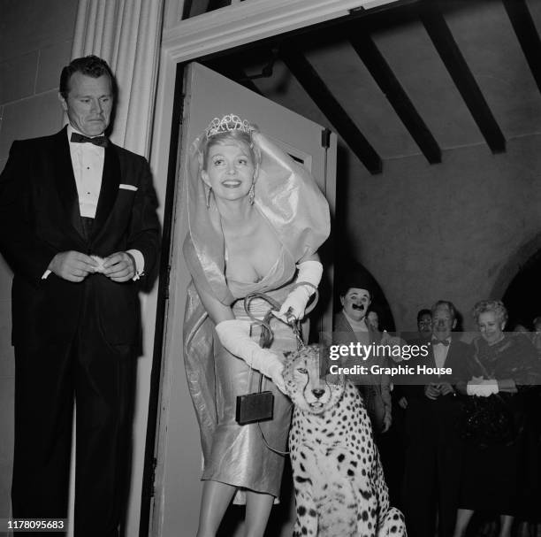 Danish actress and model Greta Thyssen attends the Publicists' Ballyhoo Ball in Los Angeles, USA, with a pet cheetah, circa 1955.