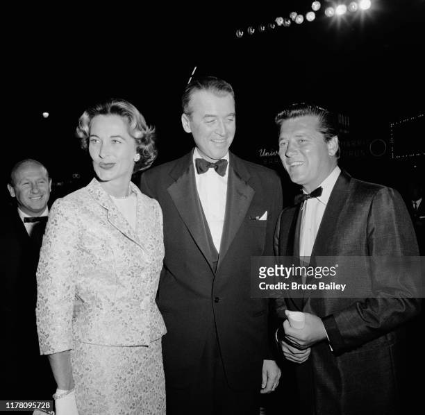 American actor James Stewart and his wife Gloria Hatrick McLean with actor Gordon MacRae at the premiere of the film 'The Spirit of St Louis' at...