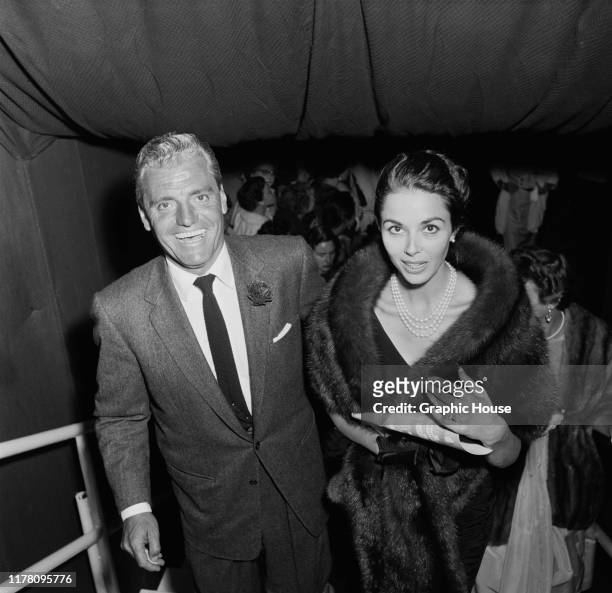 English actress Dana Wynter with her husband, attorney Greg Bautzer at the Shipstads & Johnson Ice Follies, USA, circa 1957.