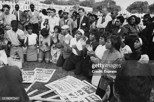 Civil Rights Protestor Civil rights protesters kneeling to sing 'Freedom is a-Coming to the ...