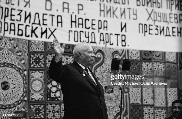 Soviet leader Nikita Khrushchev during a visit to Cairo, Egypt, May 1964. Above him is a welcome message in Russian.