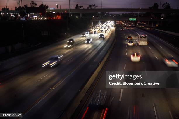 vehicle light trails on the 405 freeway - main road stock pictures, royalty-free photos & images