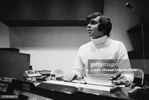 Eddie Gray, the guitarist of the band Tommy James and the Shondells using a Sho-Bud pedal steel guitar during a recording session for their track...