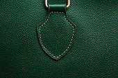 Close-up of a green leather bag texture background