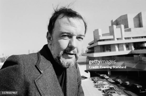 English theatre, opera and film director Peter Hall on Waterloo Bridge in front of the newly completed National Theatre on the South Bank, London,...