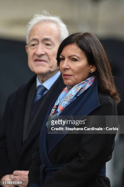 French Formers Paris Mayor's Jean Tiberi and Anne Hidalgo arrive to attend a church service for former French President Jacques Chirac at Eglise...