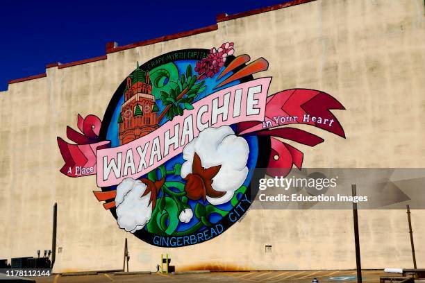 Mural promoting the city on building wall in downtown Waxahachie Texas.