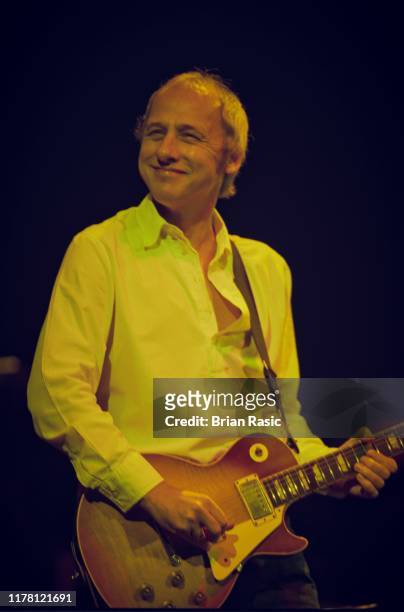 English singer, songwriter, musician and guitarist Mark Knopfler plays his Gibson Les Paul Standard guitar on stage at the Royal Albert Hall in...