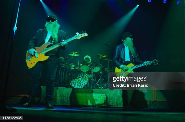 From left, bass guitarist Dusty Hill, drummer Frank Beard and guitarist Billy Gibbons of American rock group ZZ Top perform live on stage at Brixton...