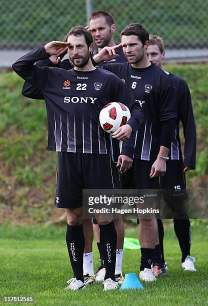 Andrew Durante, Mark Paston, Tim Brown and Jimmy Downey finish a drill during a Wellington Phoenix training session at Newton Park on July 1, 2011 in...