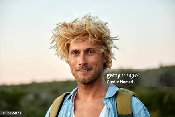 close-up of hiker with messy hair - man blonde hair stock pictures, royalty-free photos & images