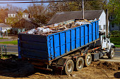 Recycling container trash dumpsters being full with garbage