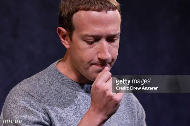 Facebook CEO Mark Zuckerberg pauses while speaking about the new Facebook News feature at the Paley Center For Media on October 25, 2019 in New York...