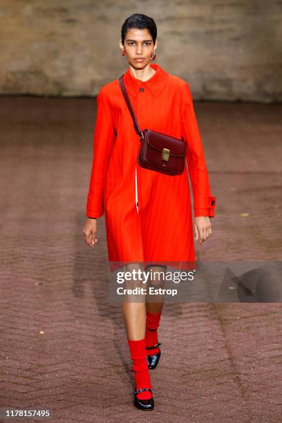 Model walks the runway during the A.P.C Womenswear Spring/Summer 2020 show as part of Paris Fashion Week on September 30, 2019 in Paris, France.