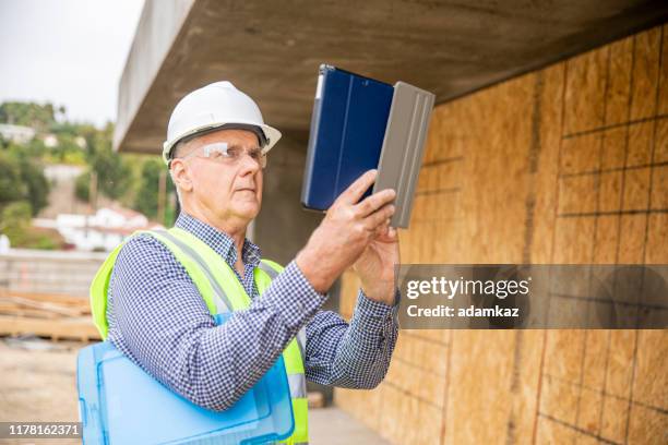 construction inspector photographing - house inspection stock pictures, royalty-free photos & images