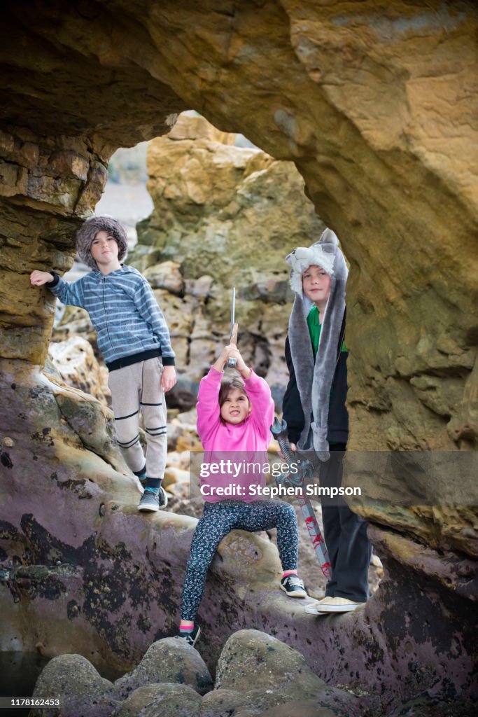 Siblings Playing In Beach Caves Low Tide High Res Stock Photo Getty siblings-playing-in-beach-caves-low-tide-high-res-stock-photo-getty