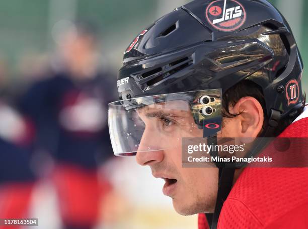 Luca Sbisa of the Winnipeg Jets looks on during practice in advance of the 2019 Tim Hortons NHL Heritage Classic to be played against the Calgary...