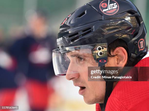 Luca Sbisa of the Winnipeg Jets looks on during practice in advance of the 2019 Tim Hortons NHL Heritage Classic to be played against the Calgary...