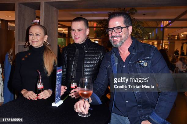 Paul Elvers with his parents Alex Jolig and Jenny Elvers during the VIP Late Night Shopping Party at Alstertal shopping mall on October 25, 2019 in...