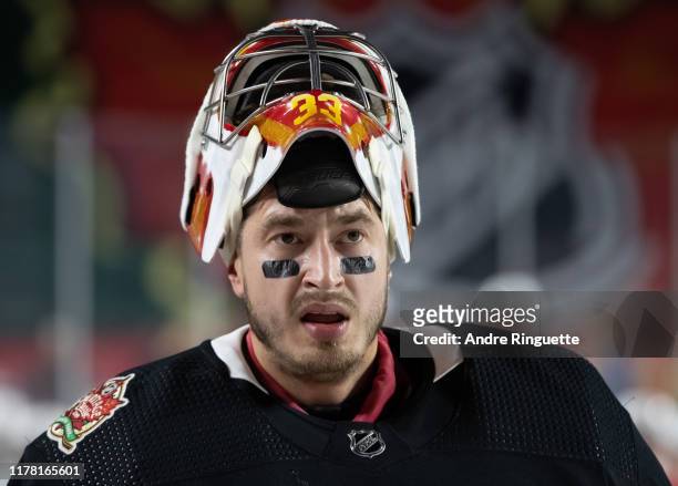 David Rittich of the Calgary Flames looks on during practice in advance of the 2019 Tim Hortons NHL Heritage Classic to be played against the...