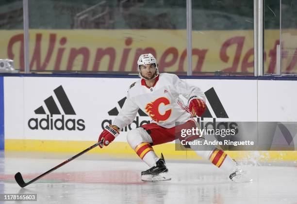 Michael Frolik of the Calgary Flames skates during practice in advance of the 2019 Tim Hortons NHL Heritage Classic to be played against the Winnipeg...