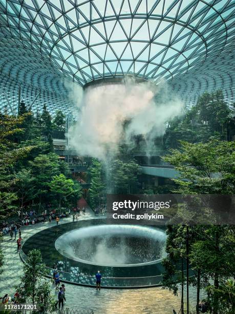 the rain vortex at jewel, changi airport, singapore - changi airport stock pictures, royalty-free photos & images