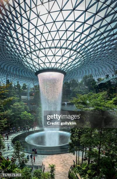 vertoramas view of the rain vortex at jewel, changi airport, singapore - changi stock pictures, royalty-free photos & images