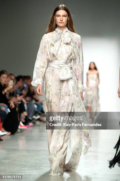Model walks the runway during the Kristina Fidelskaya Womenswear Spring/Summer 2020 show as part of Paris Fashion Week on September 30, 2019 in...